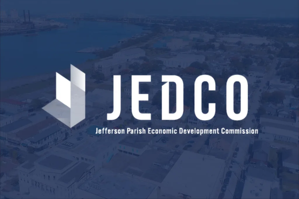 Buildings by the river, overlaid with a JEDCO logo