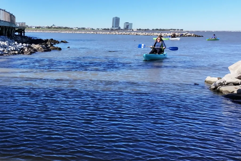 Paddlers coming into the canal at Bucktown Harbor