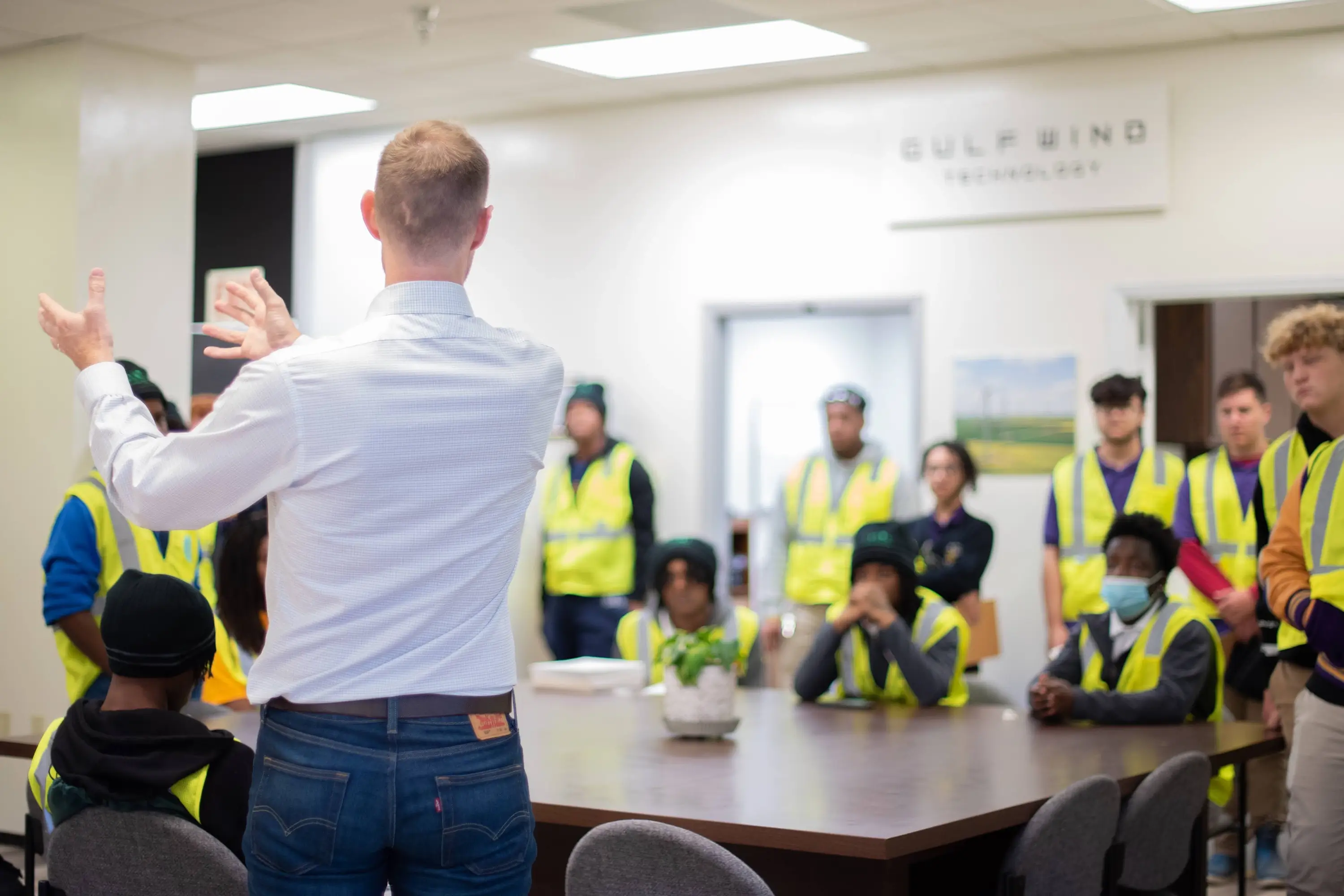 Gulf Wind holding an instructional meeting in high-vis vests