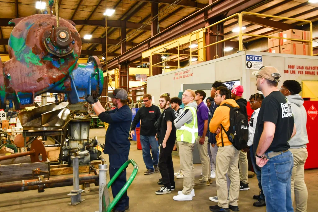 Students watching a worker
