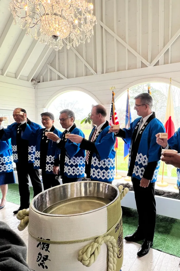 The UBE company officials holding a tasting
