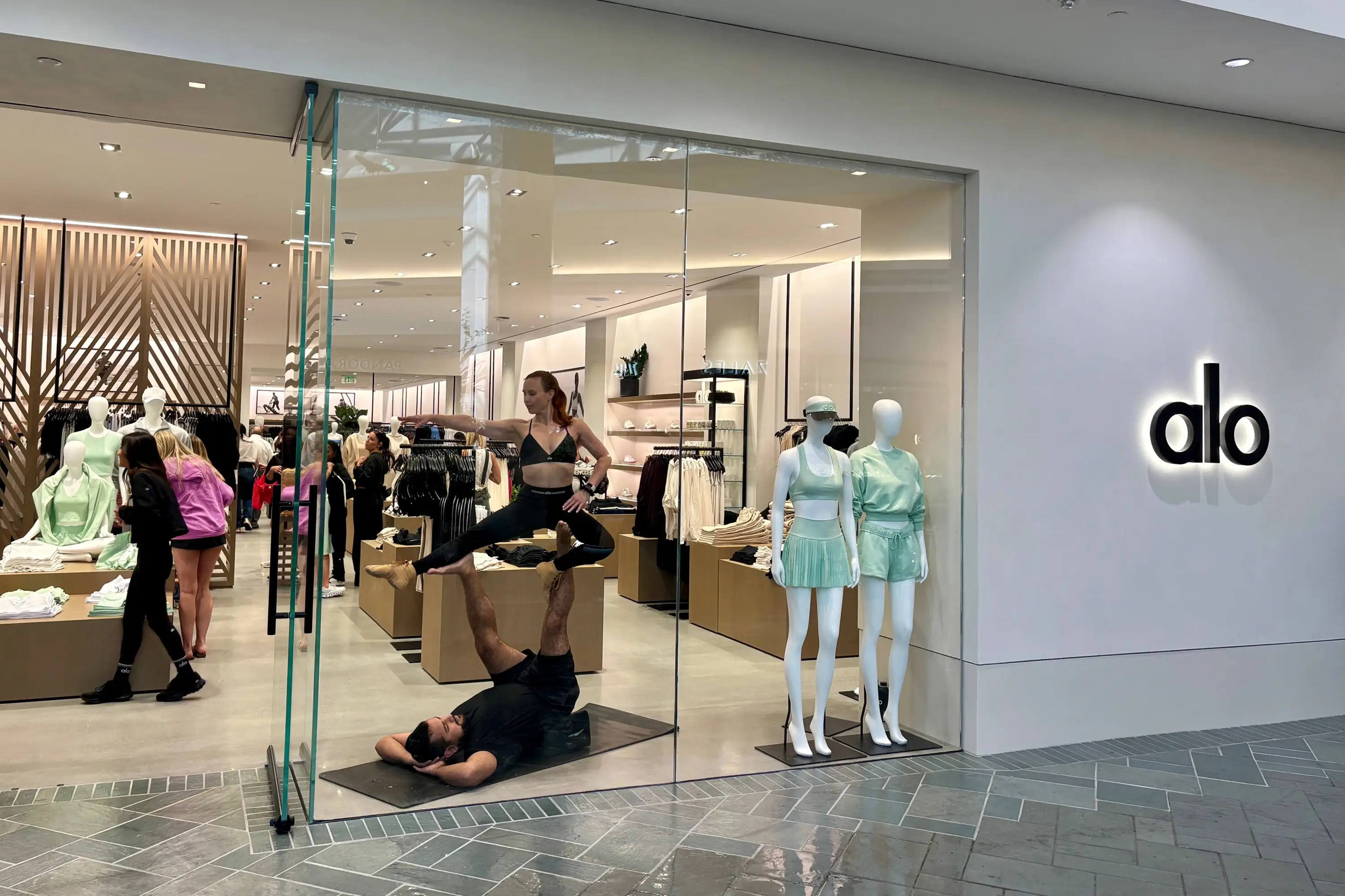 People in Alo doing acrobatic yoga