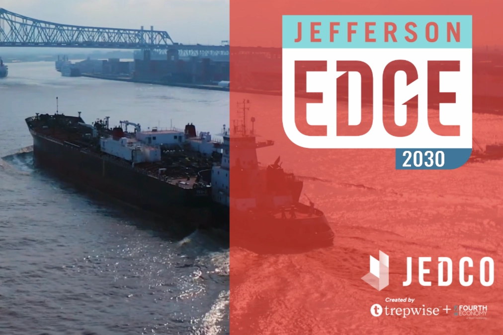 A cargo ship in the river, overlaid with a Jefferson EDGE logo